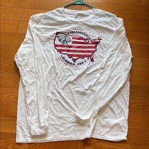 White Long Sleeve Jacksonville Jaguars Shirt with Red and Blue Graphic